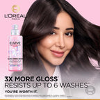 Refect Beauty L'Oreal Paris Elvive Glycolic Gloss leave-in cream bottle next to a woman with smooth, shiny dark hair.