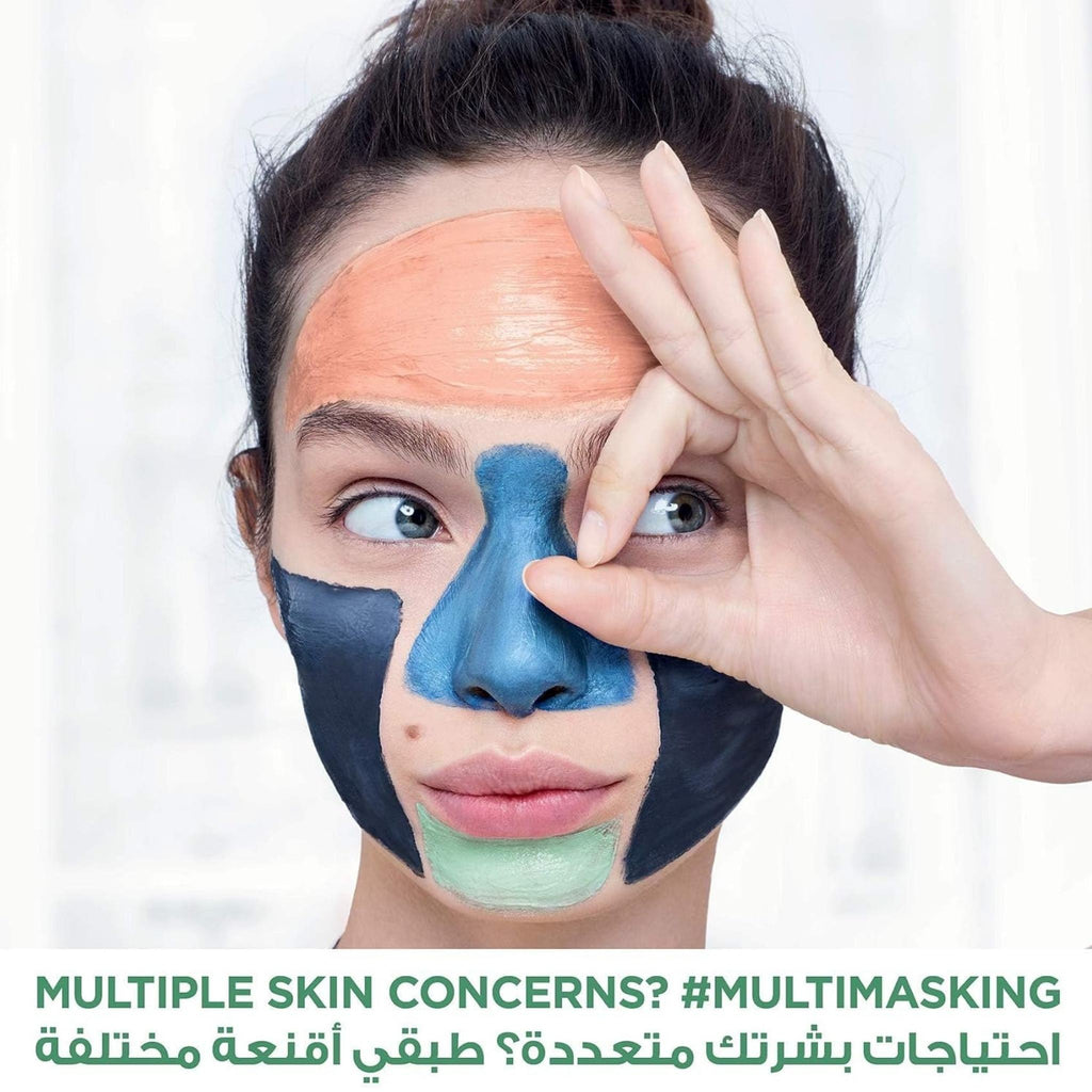 Refect Beauty model applying L'oreal Paris Pure Clay multi-masking treatment with charcoal and coloured clay masks