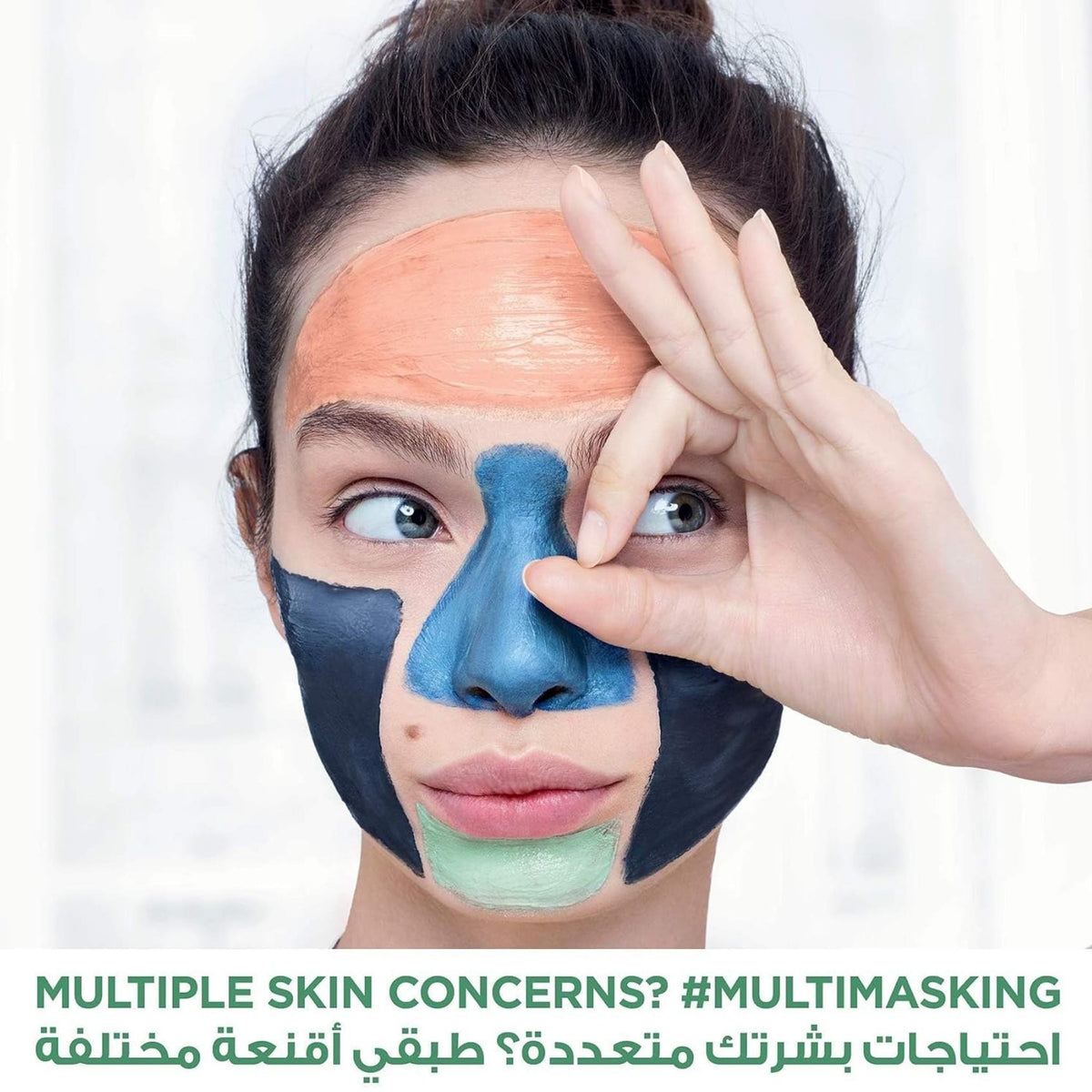 Refect Beauty model applying L'oreal Paris Pure Clay multi-masking treatment with charcoal and coloured clay masks