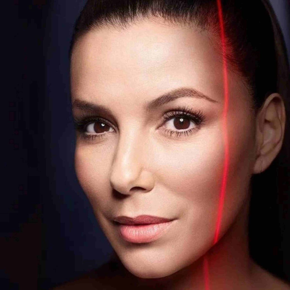 Refect Beauty L'oreal Paris Revitalift Laser X3 eye cream model with a red laser light effect on her face