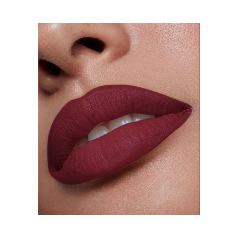 Refect Beauty LUNA semi matte lipstick in a deep berry red shade applied on lips for a smooth, vibrant finish.