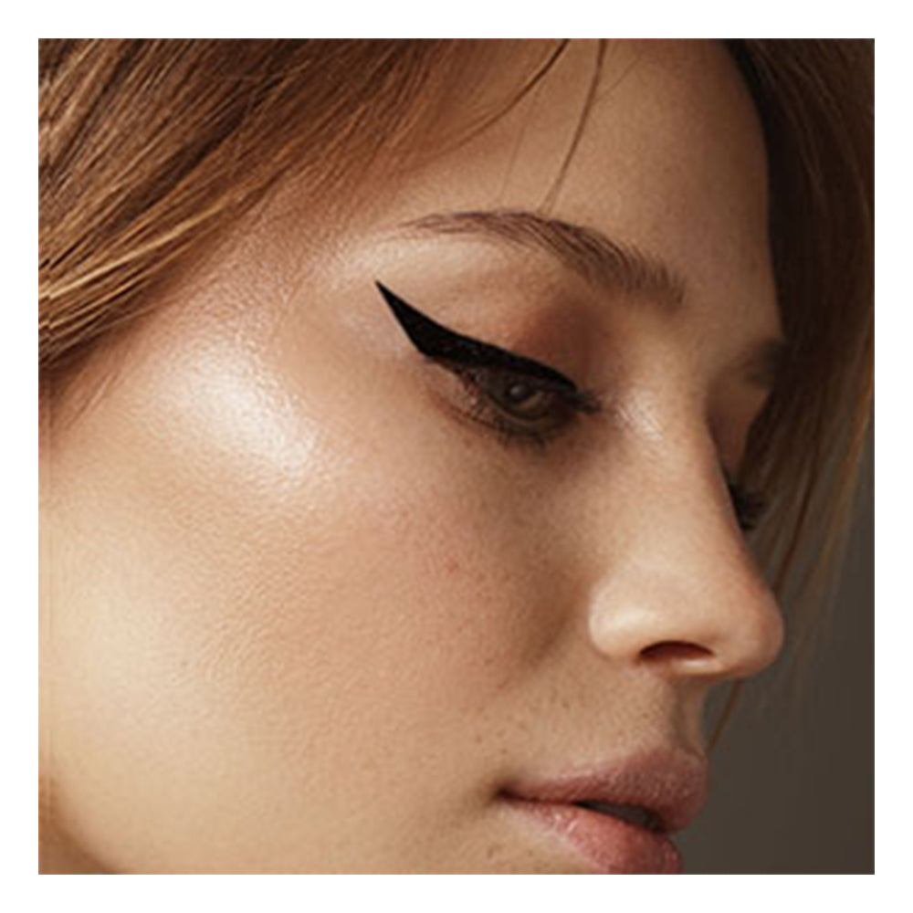Refect Beauty LUNA Dip Liner liquid eyeliner applied in a sharp, bold winged style on a model's eyelid.