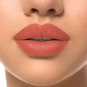 Refect Beauty LUNA Lipstick 7/11 in a soft terracotta shade applied to lips for a smooth, creamy, matte finish.