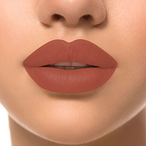 Refect Beauty LUNA Lipstick 7/11 in a rich, warm terracotta shade applied on lips for a smooth, matte finish.
