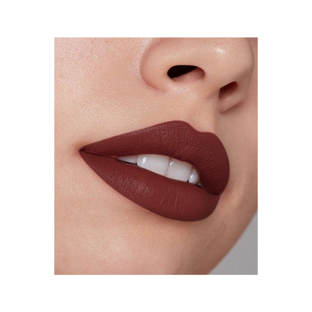 Refect Beauty LUNA Nude Lipstick in a deep, matte brown-nude shade applied on lips for a smooth, elegant finish.