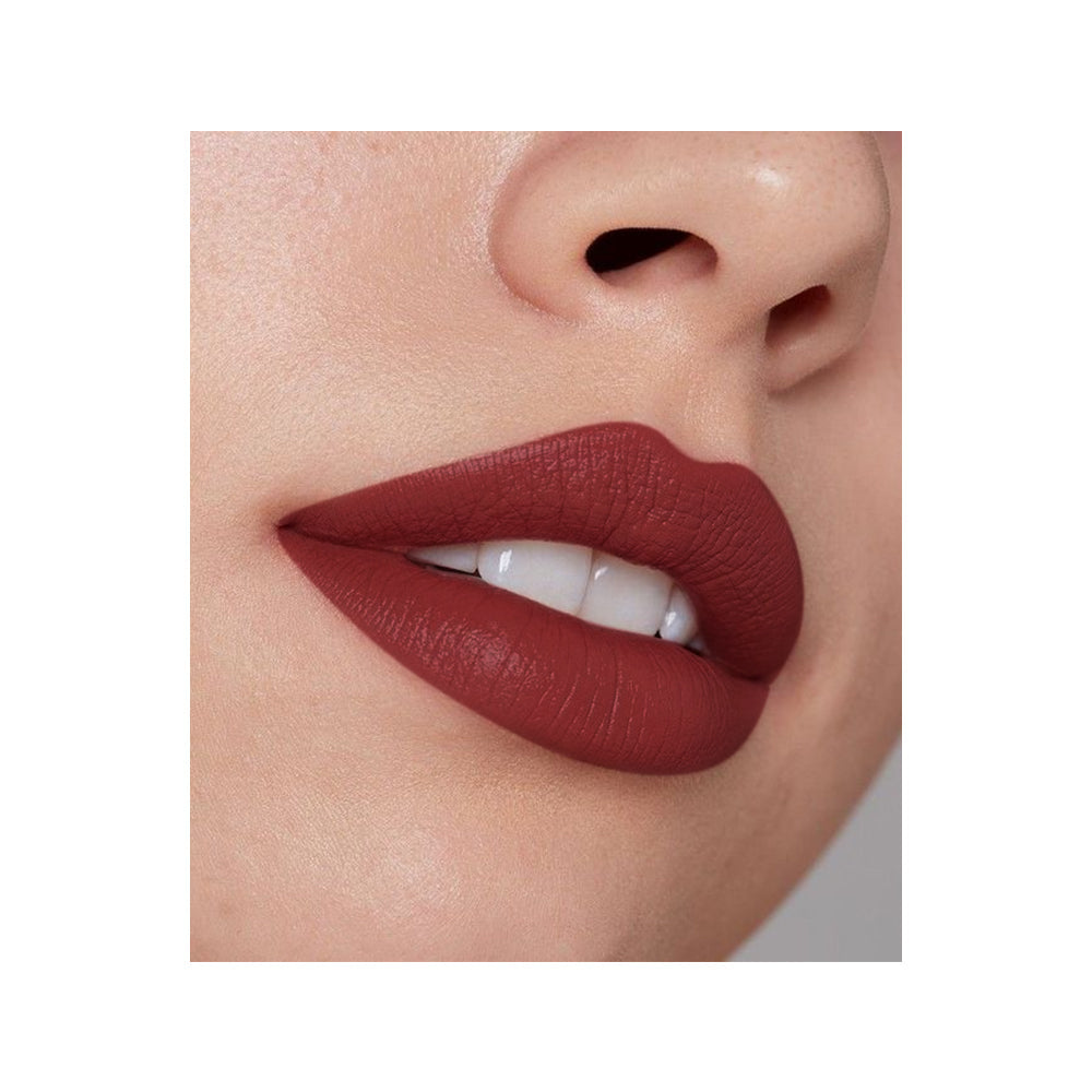 Refect Beauty LUNA nude lipstick applied on lips with a smooth matte finish and deep warm tone