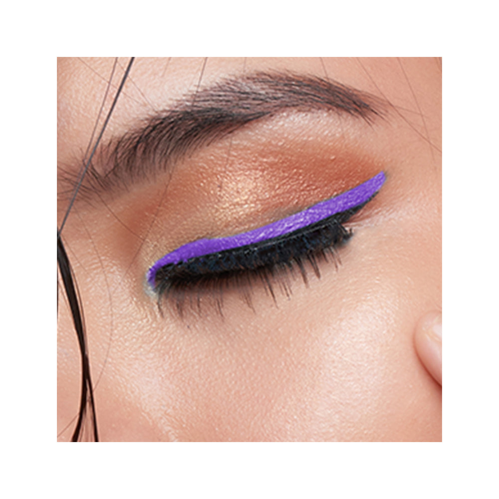 Refect Beauty LUNA Eye Liner Pencil applied as a vibrant purple winged eyeliner on a model with gold eyeshadow