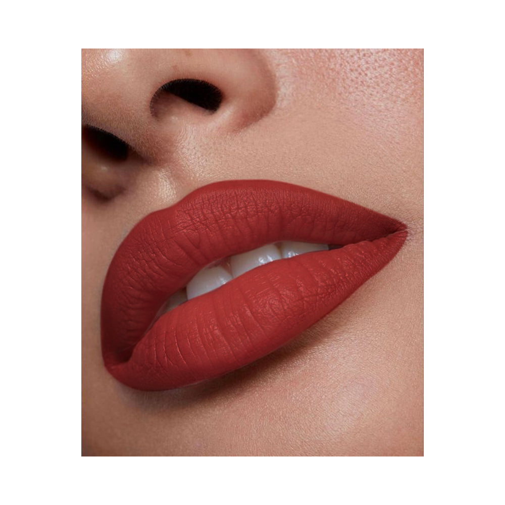 Refect Beauty LUNA semi matte lipstick in a rich red shade applied on lips for a smooth and vibrant finish