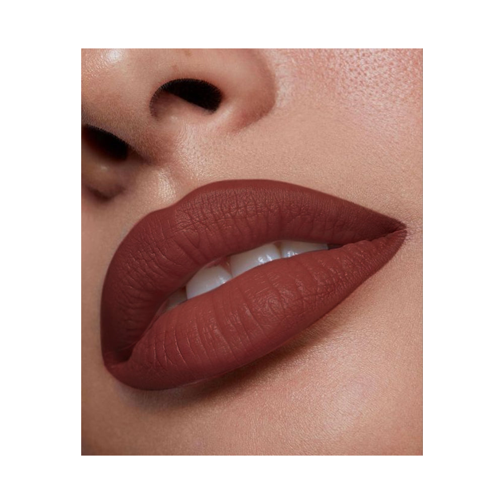 Refect Beauty LUNA semi matte lipstick in a rich deep brown shade applied on lips for a smooth, soft matte finish.