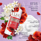 Refect Beauty Lux Romantic Hibiscus body wash bottle surrounded by jasmine flowers and hibiscus petals
