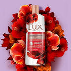 Refect Beauty Lux Romantic Hibiscus body wash bottle surrounded by vibrant red and orange hibiscus flowers