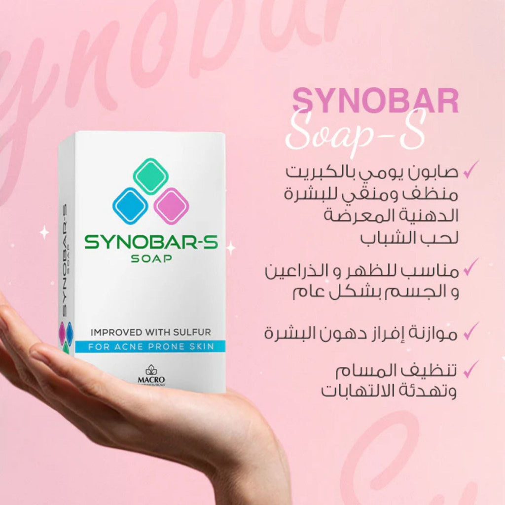 Refect Beauty Macro Synobar-S medicated cleansing bar for acne-prone skin held in a hand against a pink background.