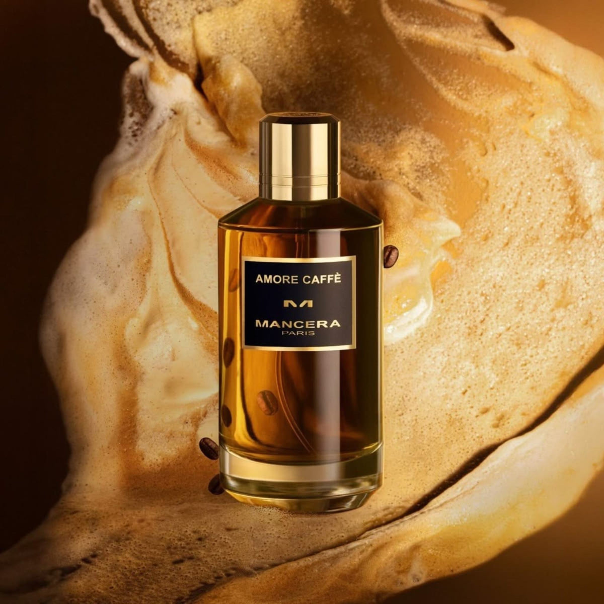 Refect Beauty Mancera Amore Caffè Eau de Parfum bottle surrounded by swirling coffee foam and roasted coffee beans.
