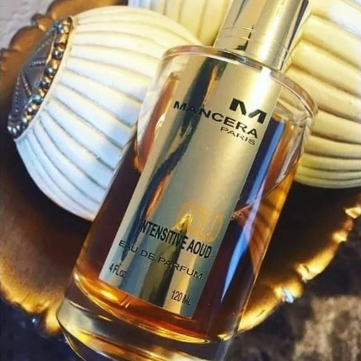 Refect Beauty Mancera Gold Intensive Aoud Eau de Parfum in a gold-toned glass bottle with elegant branding