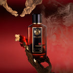 Refect Beauty Mancera Paris Red Tobacco Eau de Parfum bottle surrounded by tobacco leaves and smoke on a red background