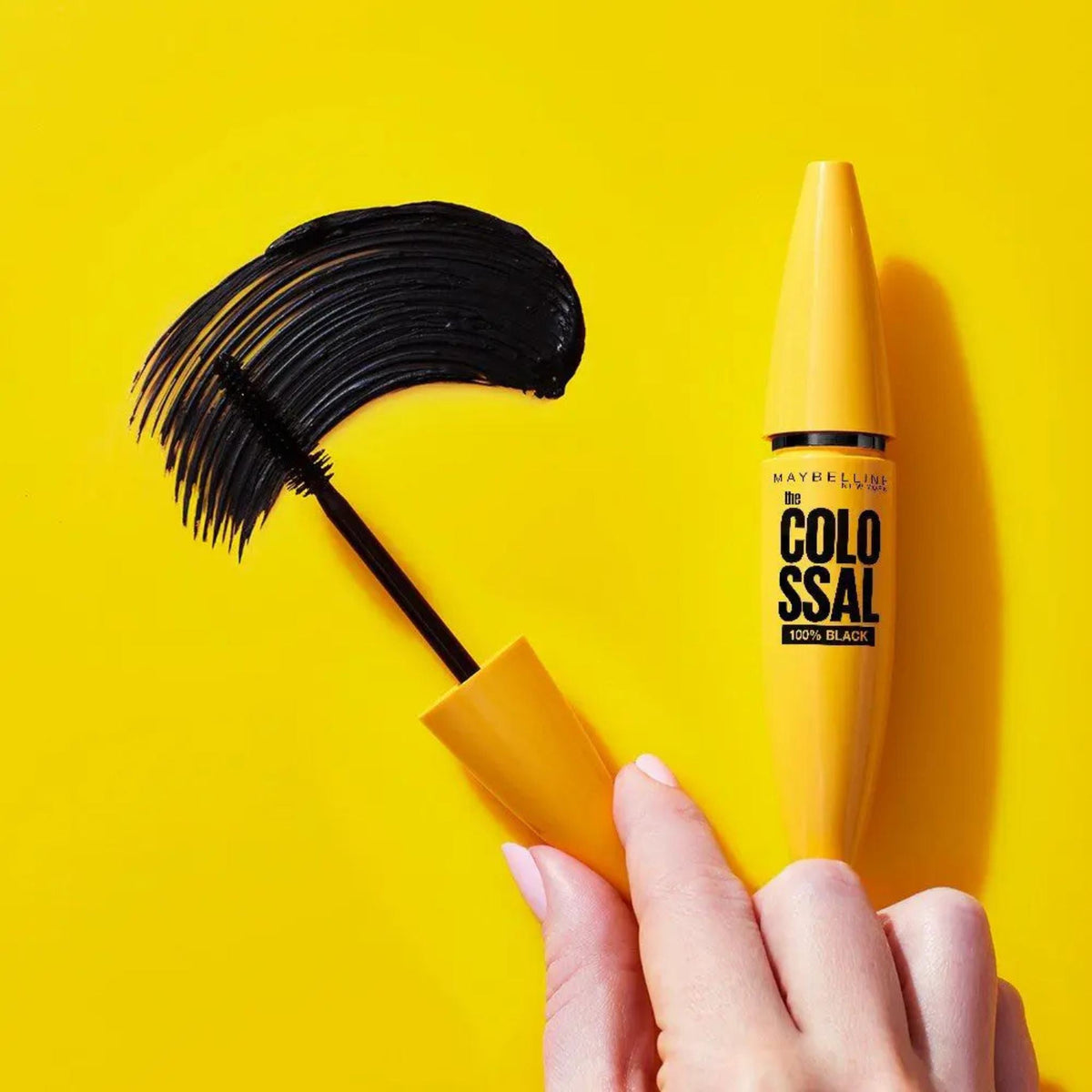 Refect Beauty Maybelline Colossal 100% Black mascara tube with mega brush showing a thick black formula swatch