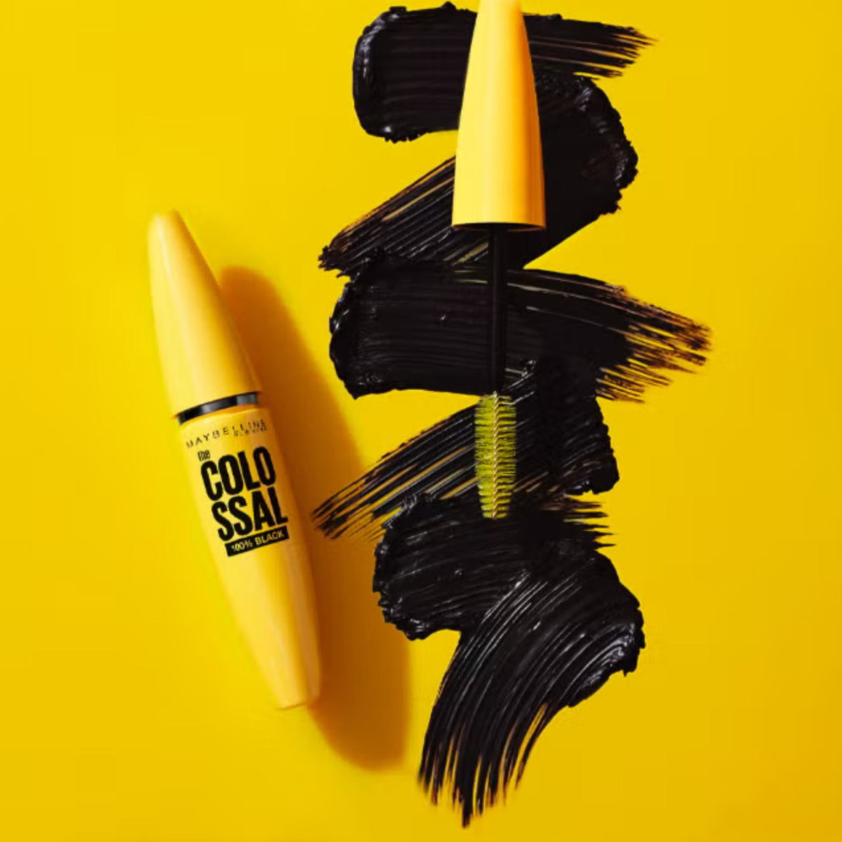 Refect Beauty Maybelline Colossal 100% Black mascara tube and mega brush with intense black pigment swatches