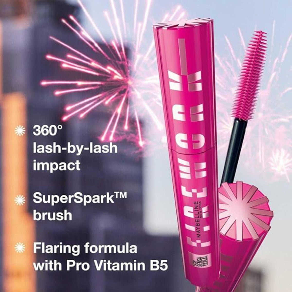 Refect Beauty Maybelline Lash Sensational Firework Mascara in black with a pink tube and spiral brush against fireworks