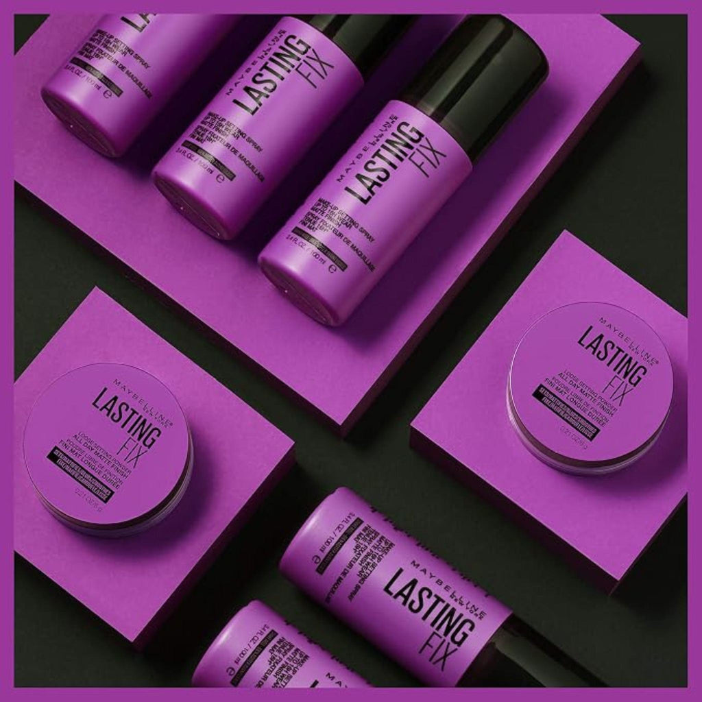 Refect Beauty collection of Maybelline Lasting Fix matte setting spray bottles and loose powder containers on purple