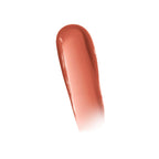 Refect Beauty Maybelline Lifter Glaze Lip Balm swatch showing a glossy, warm terracotta tinted hydrating lip oil
