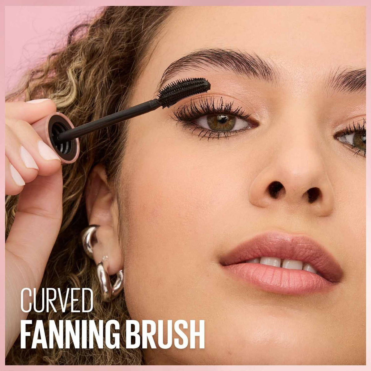 Refect Beauty Maybelline Lash Sensational mascara being applied with a curved fanning brush for defined black lashes
