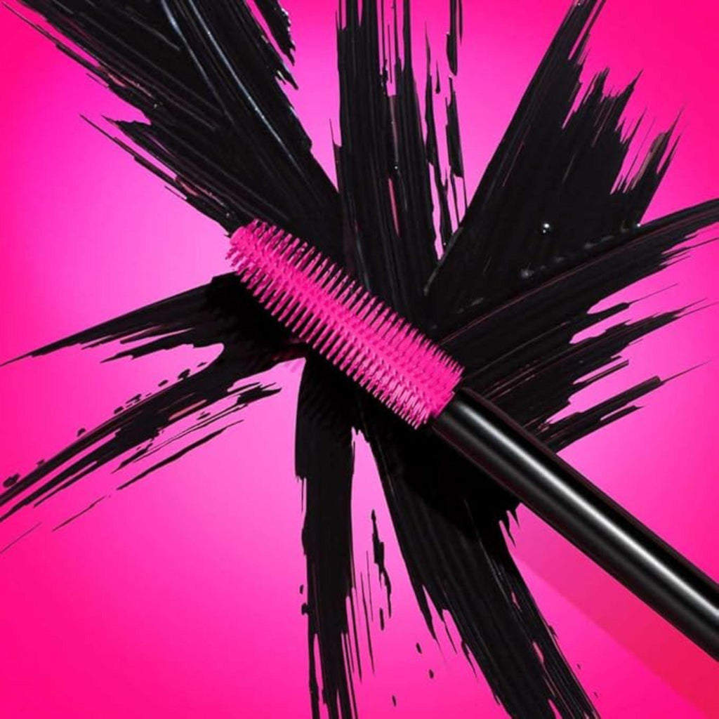 Refect Beauty Maybelline Lash Sensational Fireworks mascara brush with flexible bristles against a black paint splash