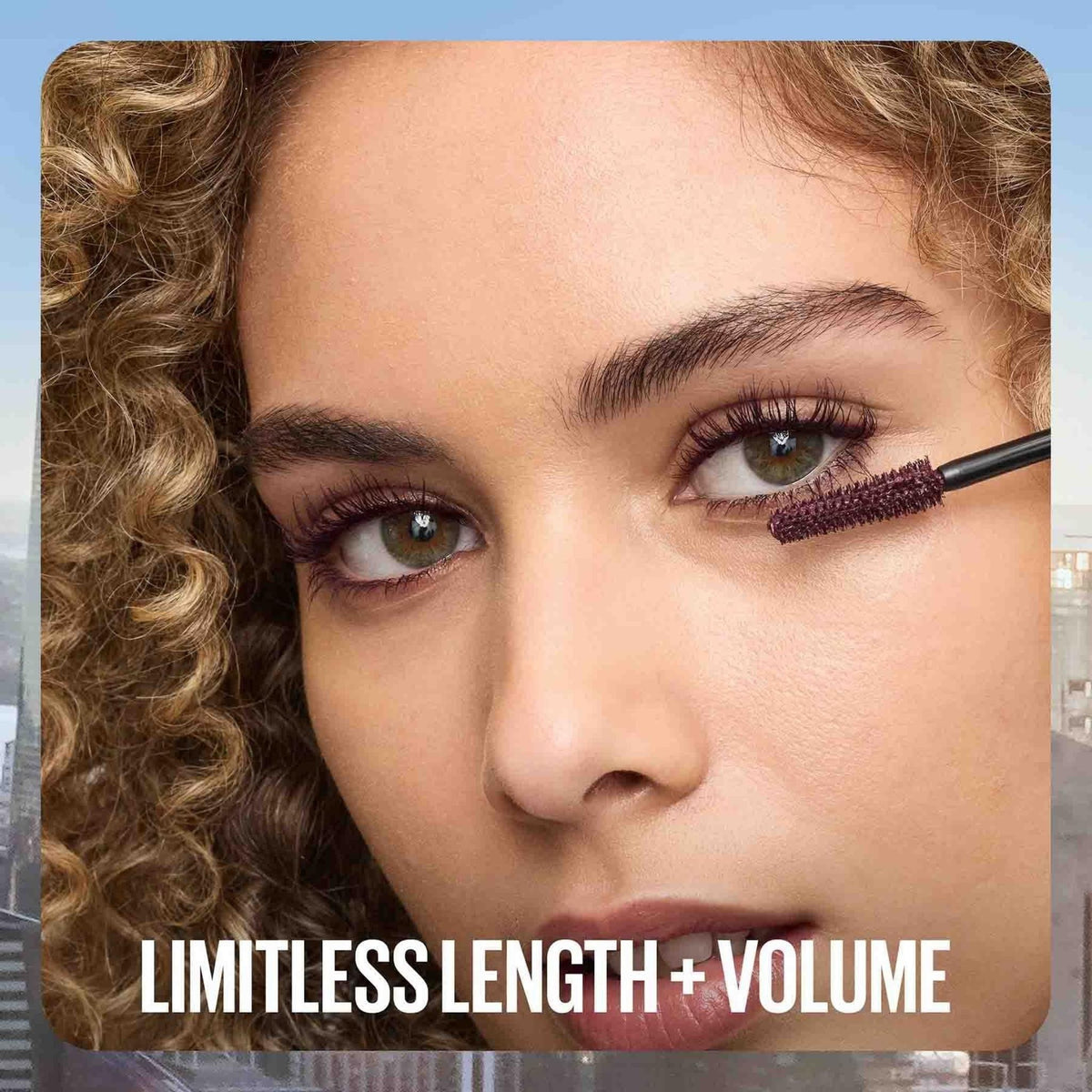 Refect Beauty model applying Maybelline Lash Sensational Sky High mascara with a flexible wand for length and volume.