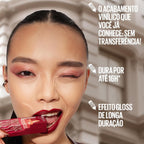 Refect Beauty model wearing deep red Maybelline Super Stay Vinyl Ink liquid lipstick with a high-shine finish