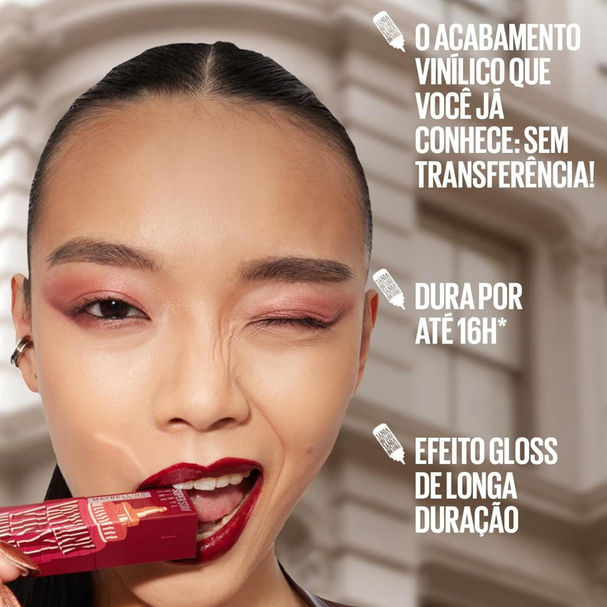 Refect Beauty model wearing deep red Maybelline Super Stay Vinyl Ink liquid lipstick with a high-shine finish