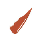 Refect Beauty Maybelline Super Stay Vinyl Ink Sauce liquid lipstick swatch showing a glossy terracotta red pigment.