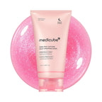 Refect Beauty Medicube PDRN Pink Caffeine overnight wrapping mask in a light pink tube against a shimmering pink gel.