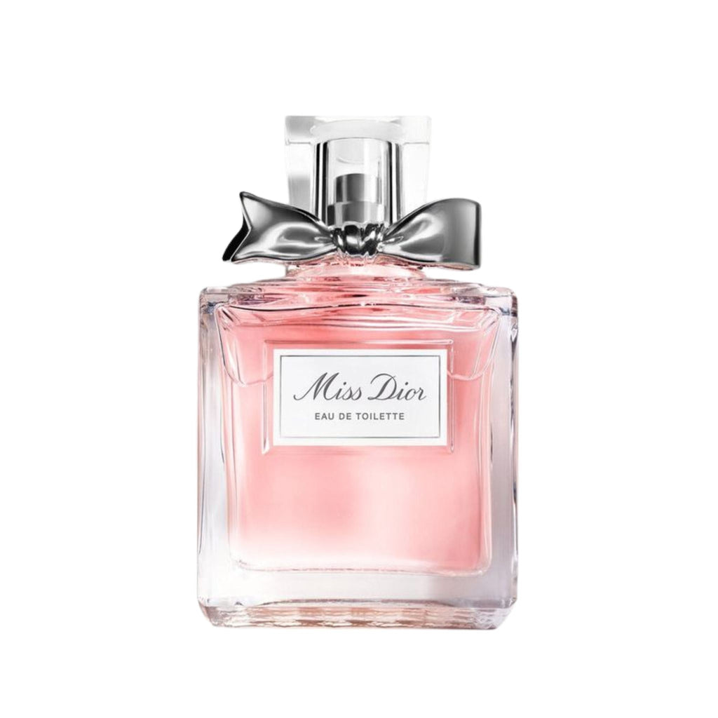 Refect Beauty Miss Dior Eau de Toilette perfume bottle with a soft pink liquid and a signature silver bow detail.