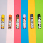 Refect Beauty MORFOSE dry shampoo collection featuring six colorful aerosol cans on a vibrant multi-colored background.