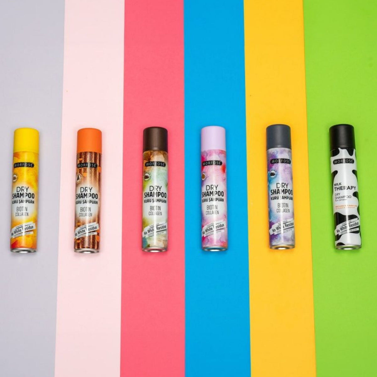 Refect Beauty MORFOSE dry shampoo collection featuring six colorful aerosol cans on a vibrant multi-colored background.
