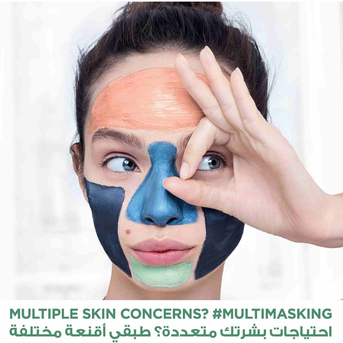Refect Beauty model applying multi-masking treatment with different colored clay masks on face for skin concerns