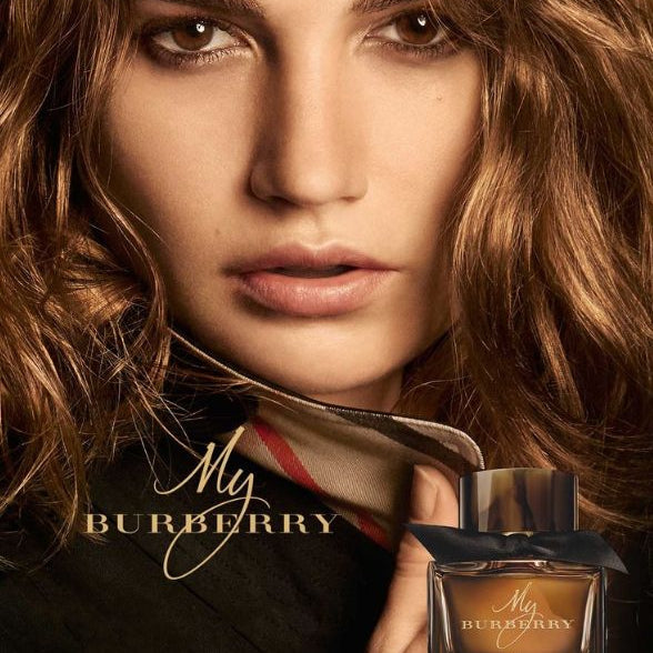 Refect Beauty My Burberry Black perfume bottle with a woman in a trench coat in the background