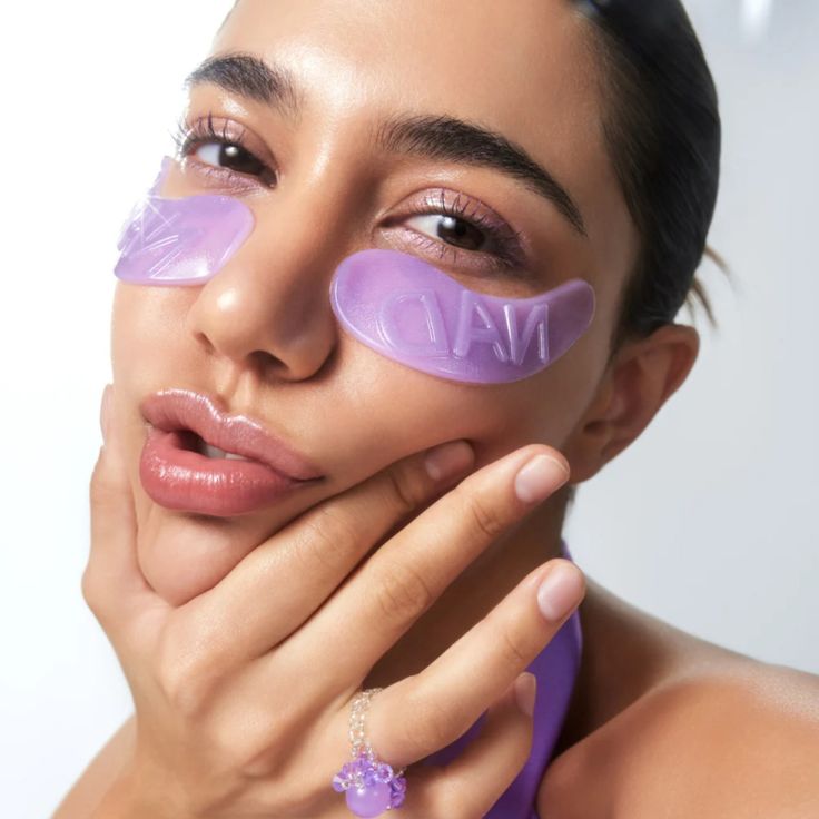 Refect Beauty Nambuzin No.9 collagen under eye patches in translucent purple applied to a woman's face