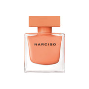 Refect Beauty Narciso Ambree Eau de Parfum in a square glass bottle with a soft peach-colored cap and liquid.