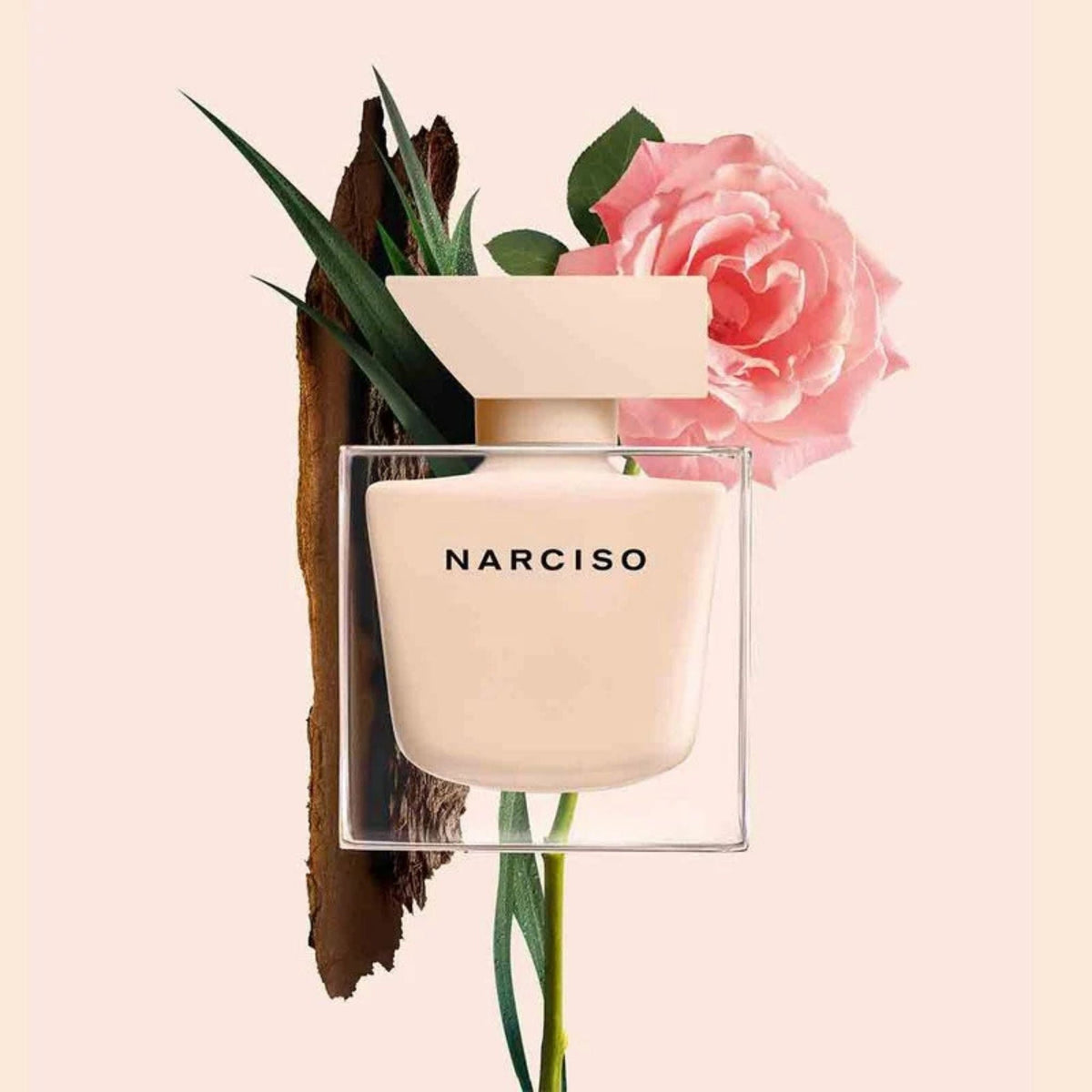Refect Beauty Narciso Poudree Eau de Parfum bottle with a soft pink finish, accented by a rose and cedarwood bark.