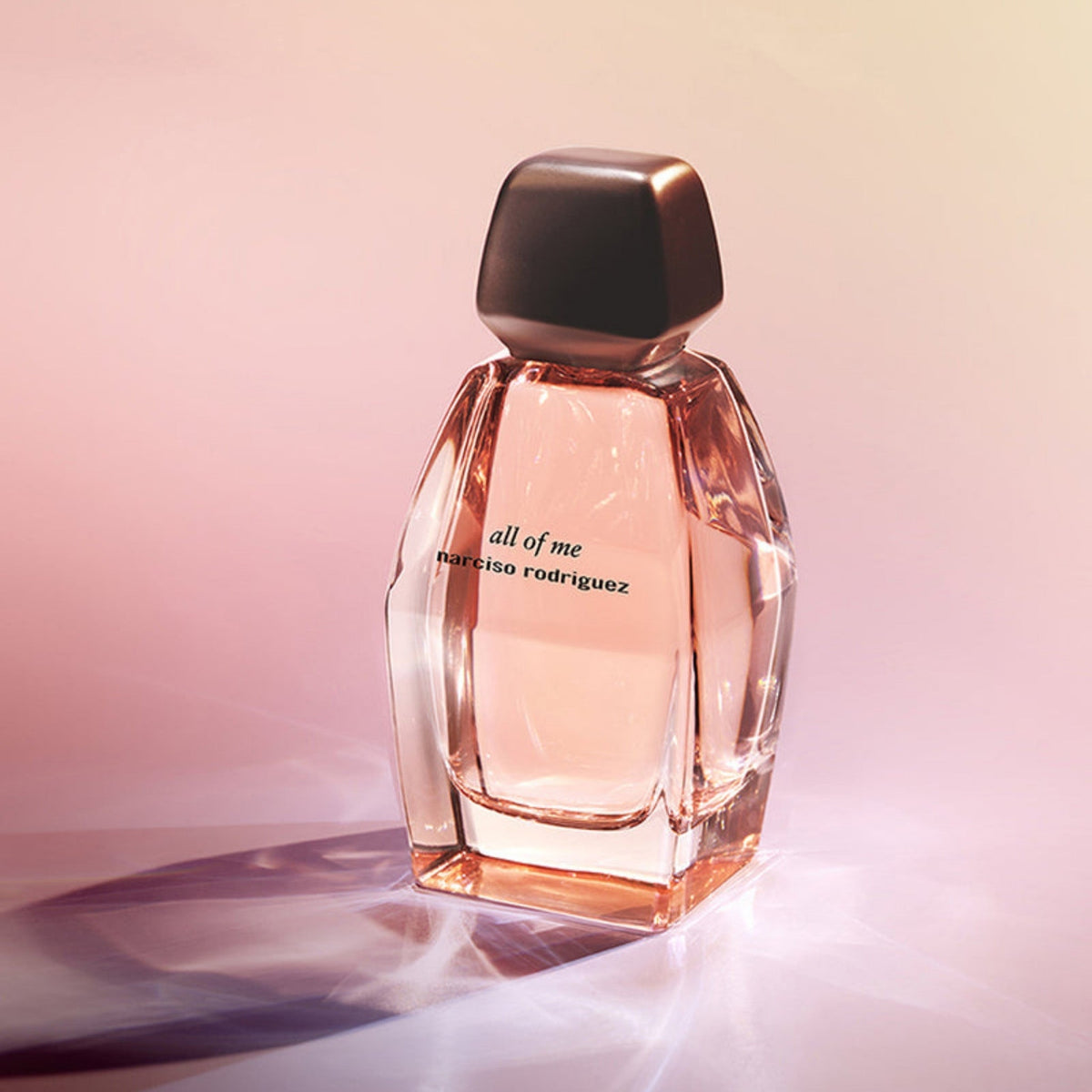 Refect Beauty Narciso Rodriguez All Of Me Eau de Parfum in a faceted glass bottle with a soft pink gradient background