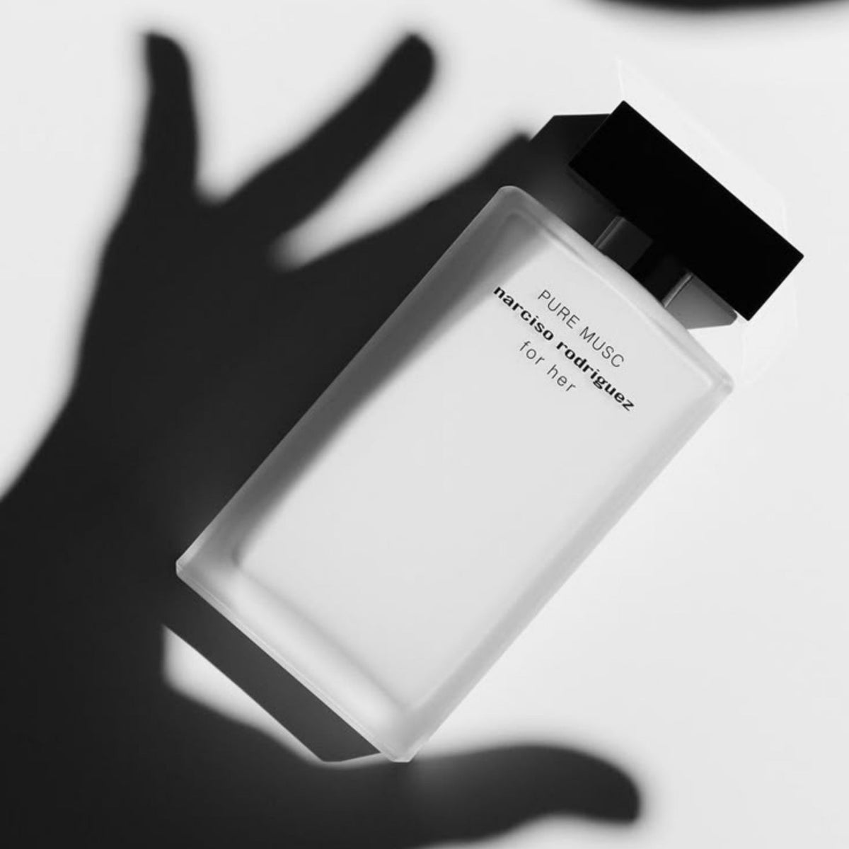 Refect Beauty Narciso Rodriguez Pure Musc perfume bottle with a minimalist frosted glass design and black cap