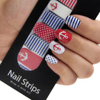 Refect Beauty Yolo nail strips featuring nautical red, white, and blue anchor, stripe, and polka dot patterns.
