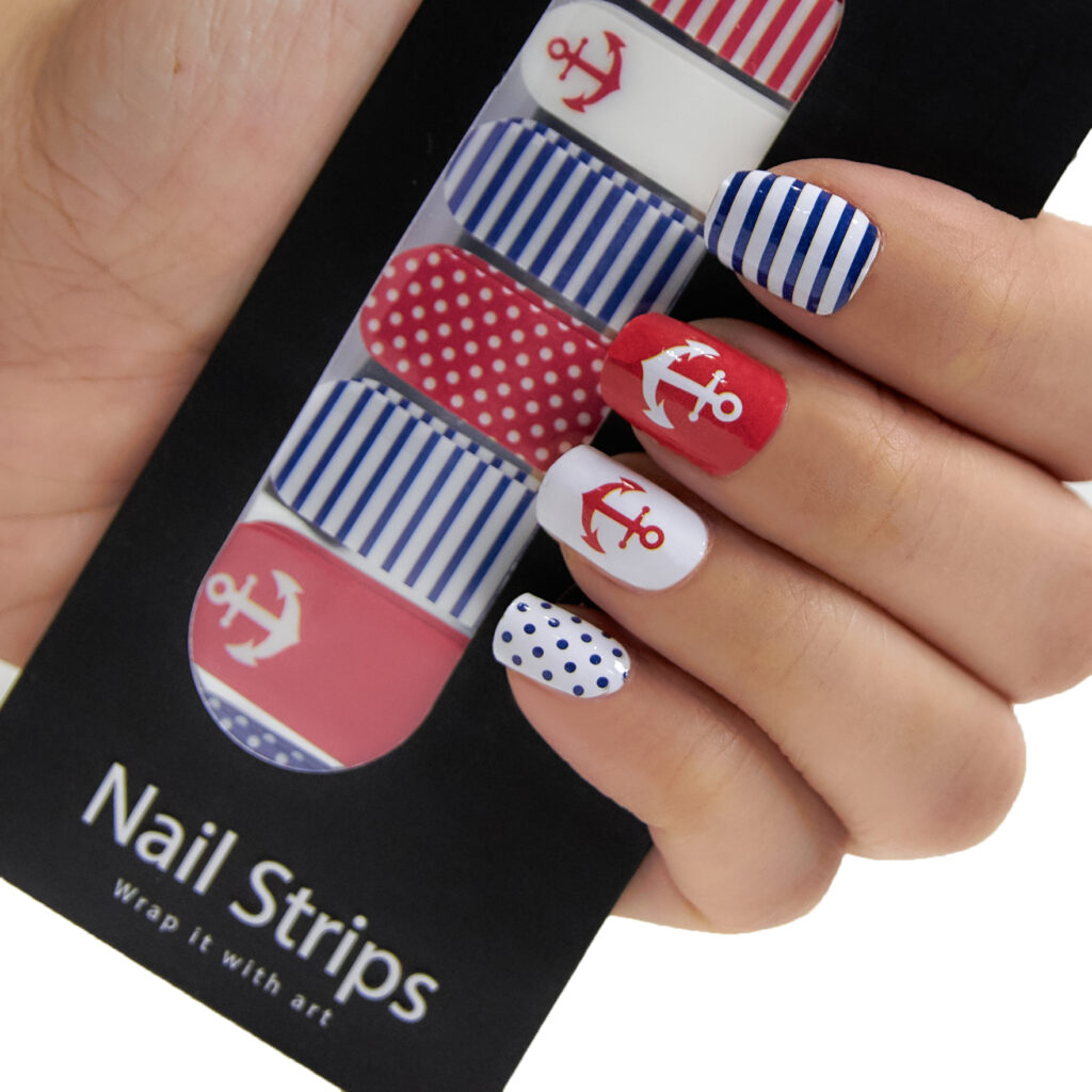 Refect Beauty Yolo nail strips featuring nautical red, white, and blue anchor, stripe, and polka dot patterns.