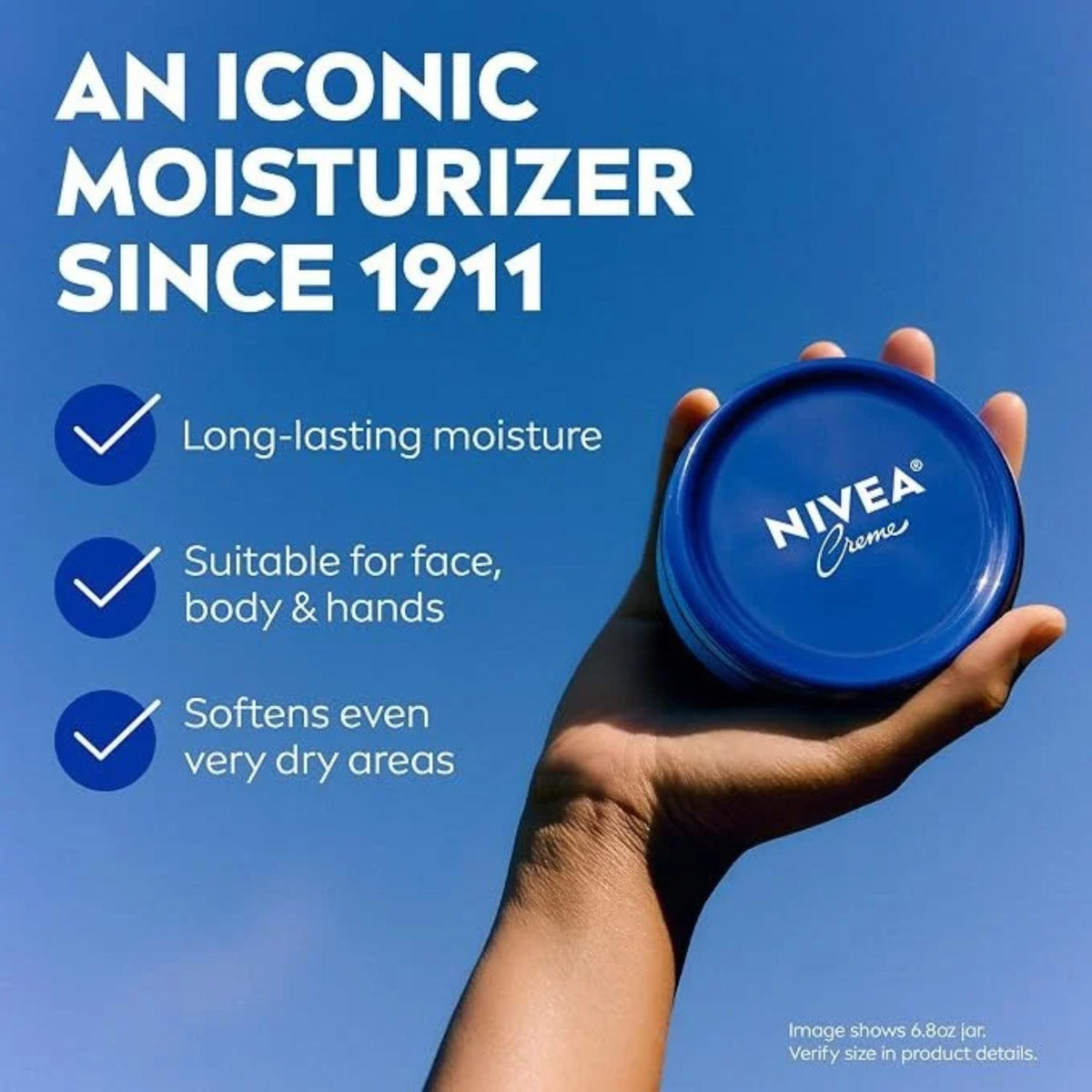 Refect Beauty Nivea Creme moisturizing cream in a blue jar held against a bright blue sky background.