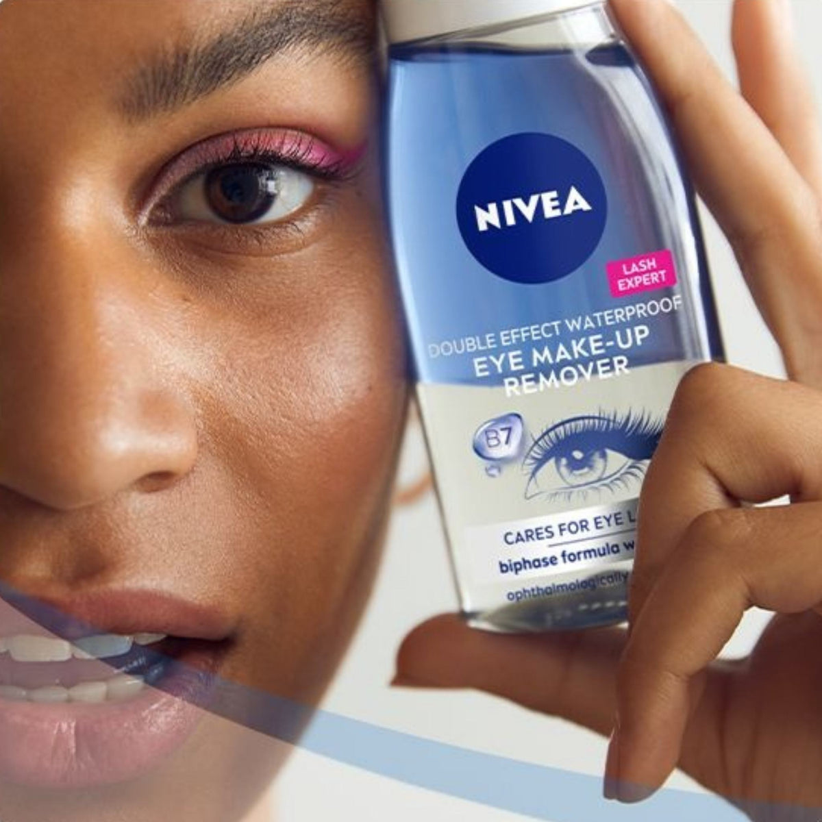 Refect Beauty model holding Nivea Double Effect dual-phase waterproof eye makeup remover bottle