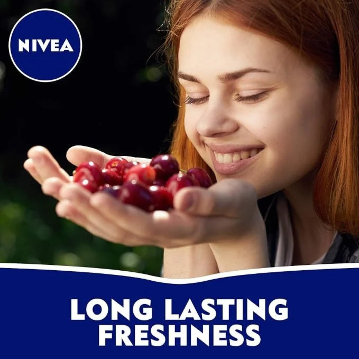 Refect Beauty woman smelling fresh cherries to represent the fruity scent of Nivea Fresh Cherry anti-perspirant