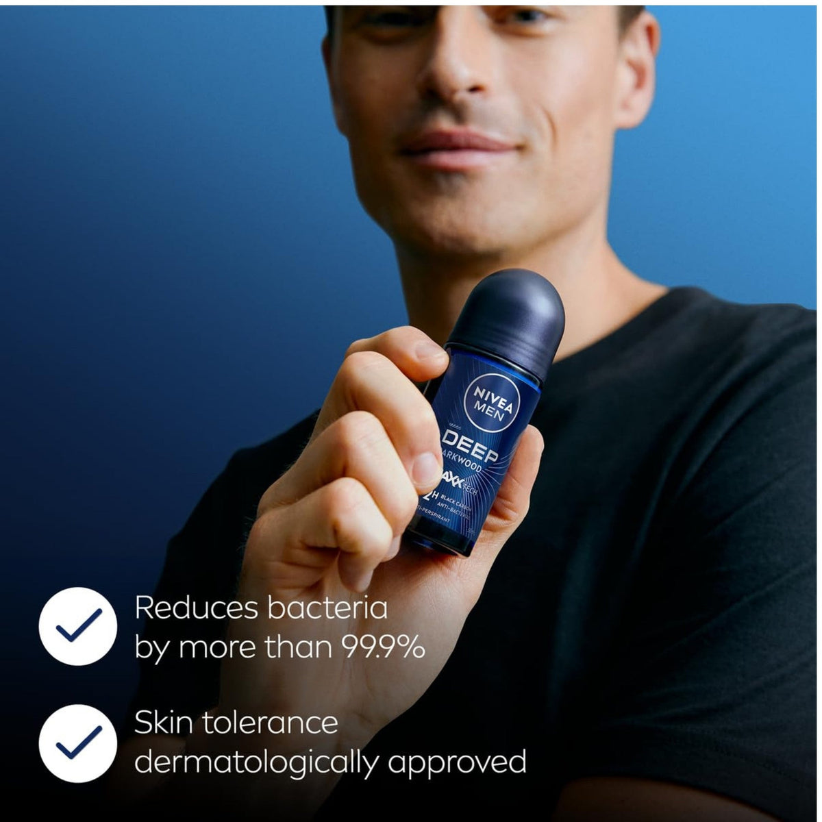 Refect Beauty Nivea Men Deep Black Carbon Dark Wood roll-on deodorant held by a man against a blue background.