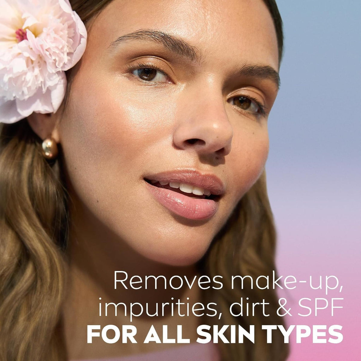 Refect Beauty model with a pink flower in her hair, showcasing clean, hydrated skin after using Nivea Micellar Water.
