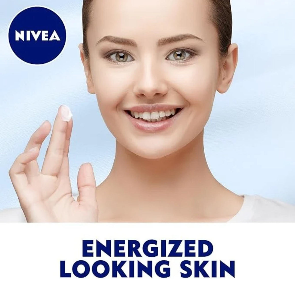 Refect Beauty Nivea Q10 Energy Recharging Night Cream applied to a smiling woman's finger for radiant skin