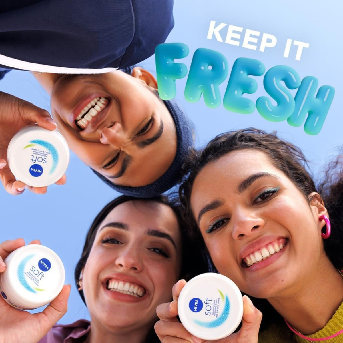 Refect Beauty Nivea Soft moisturizing cream jars held by three smiling women against a bright blue sky background.